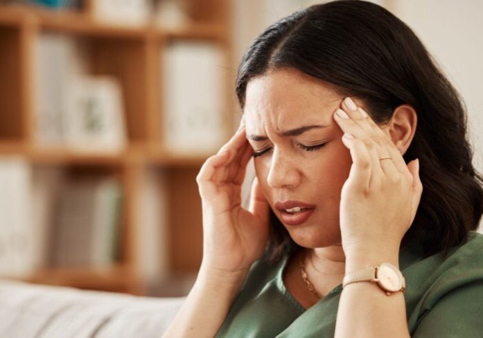 stress-headache-woman-sofa-with-vertigo-brain-fog-burnout-her-home-migraine-anxiety-female-living-room-with-problem-fail-crisis-fatigue-mental-health-problem (1)